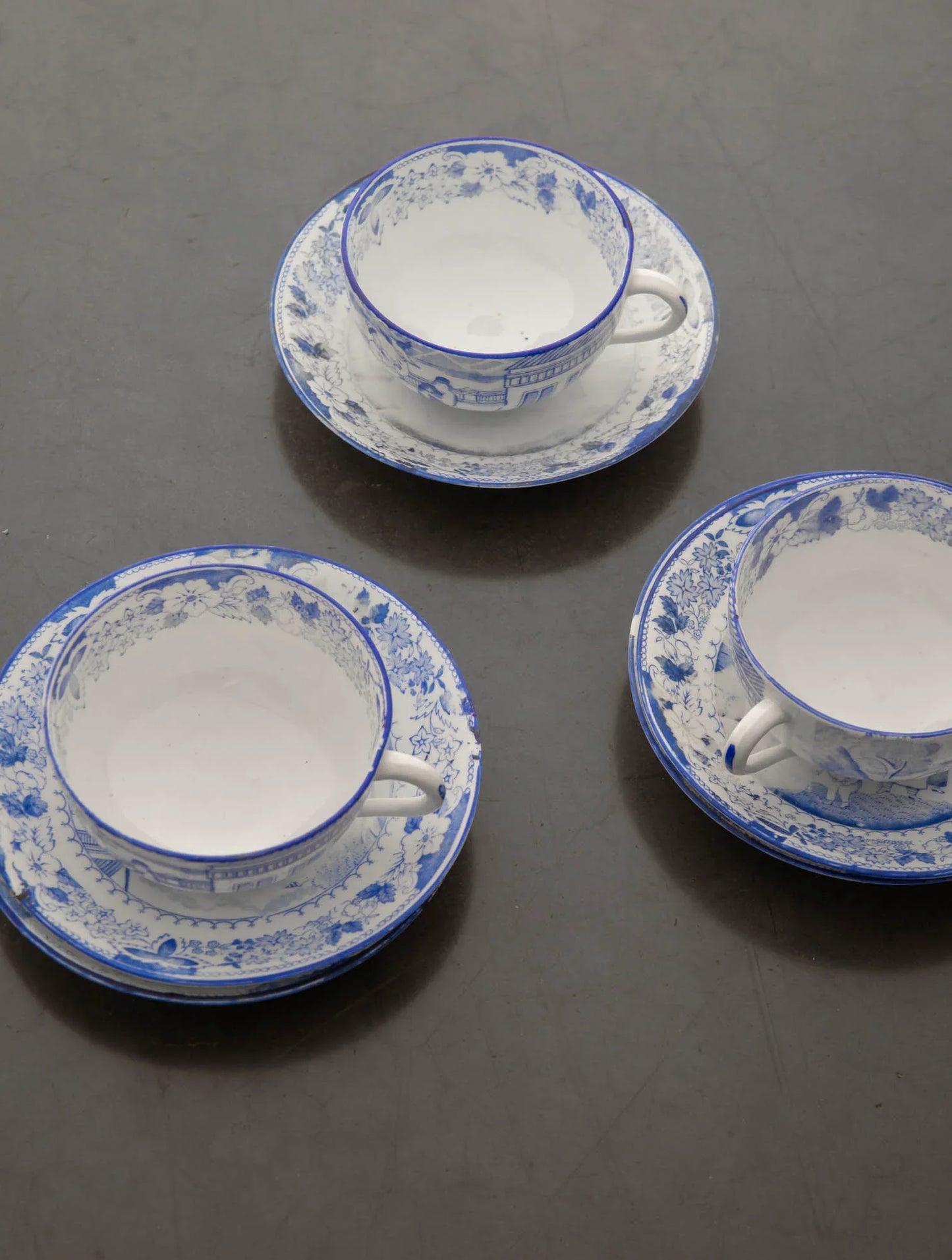 ENAMELLED PORCELAIN CUPS AND SUGAR BOWL